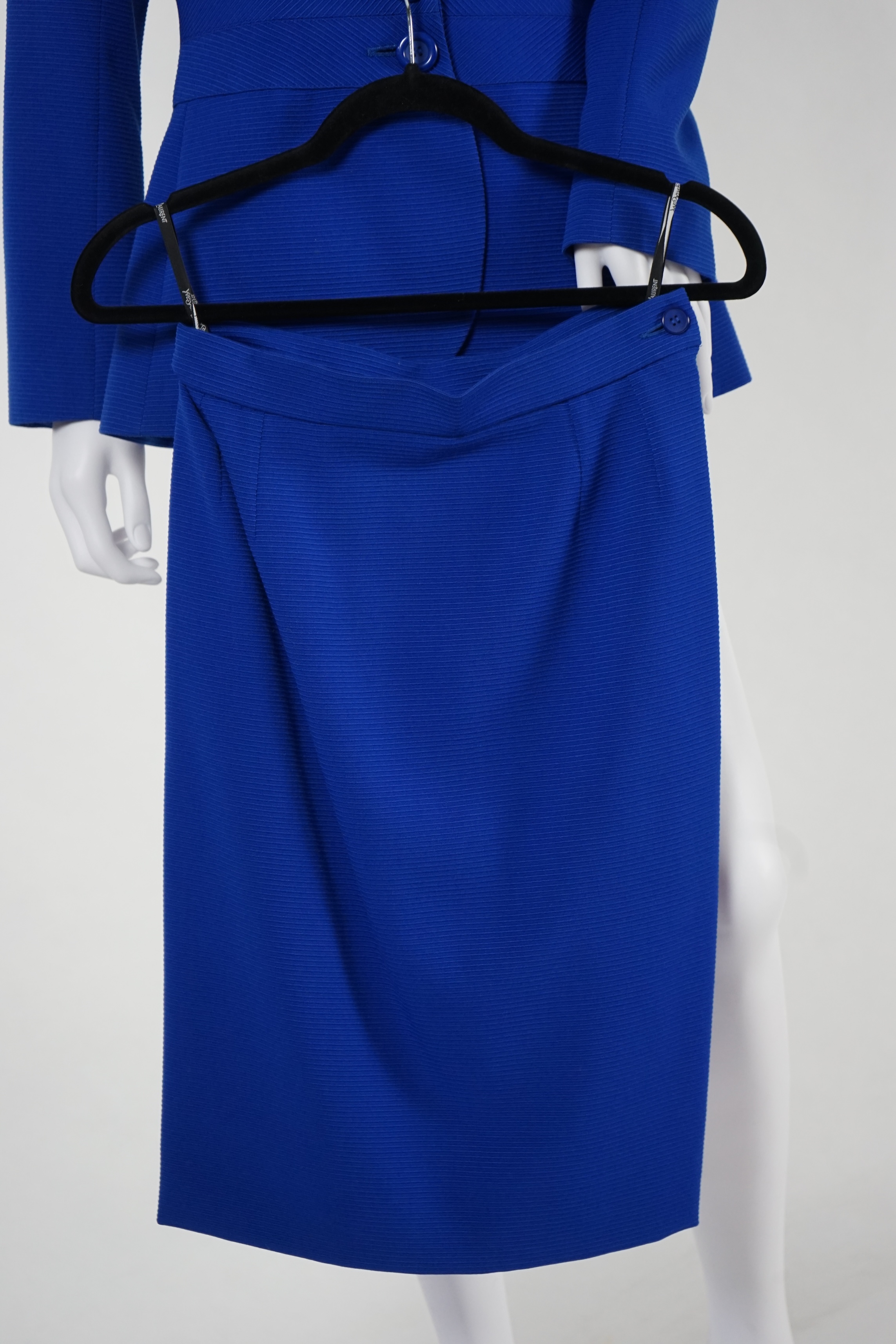 Two vintage Yves Saint Laurent variation lady's wool skirt suits, royal blue and pink. F 40 (UK 12). Please note alterations to make the waist smaller may have been carried out on some of the skirts. Proceeds to Happy Pa